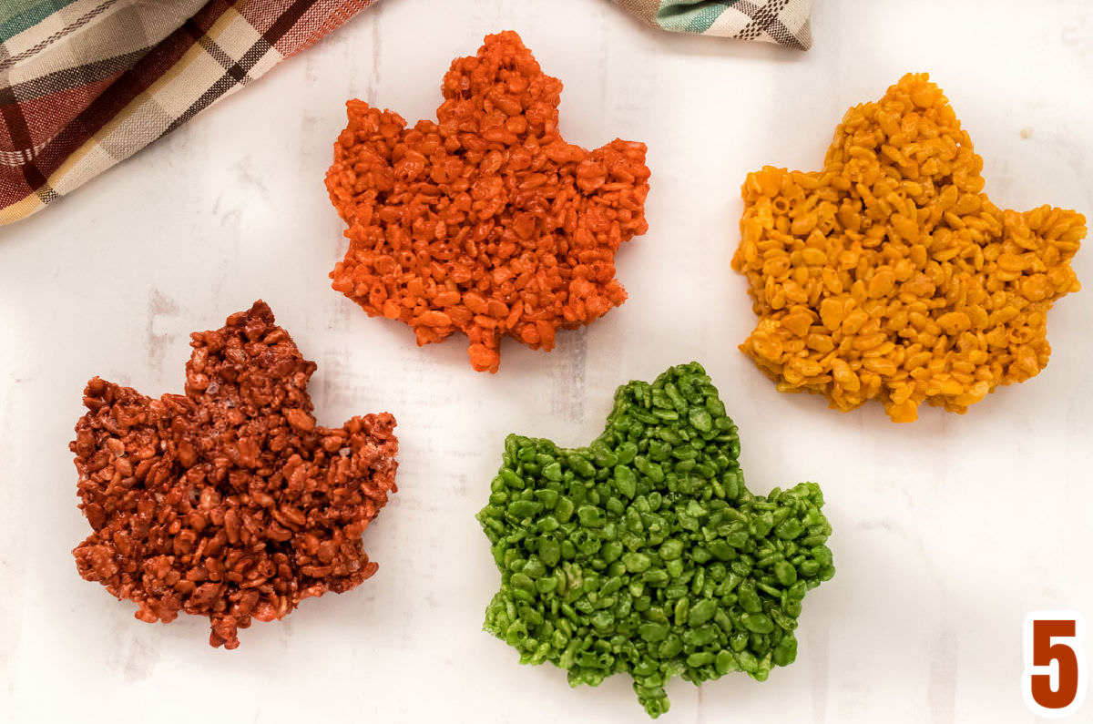 Closeup on four colors of Fall Leaves Rice Krispie Treats including Sage Green, Burnt Orange, Gold and Red/Brown.