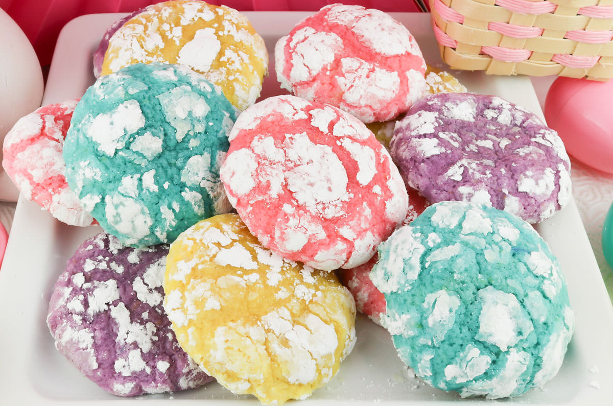 Closeup on a white plate full of Lemon Crinkle Cookies.